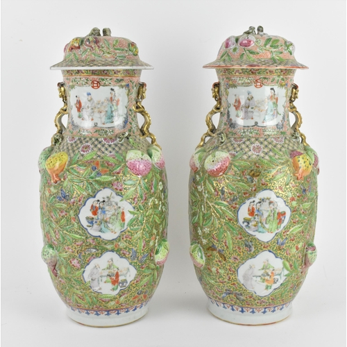 220 - A pair of Chinese Canton Qing dynasty porcelain lidded vases, 19th century, of baluster form, each w... 