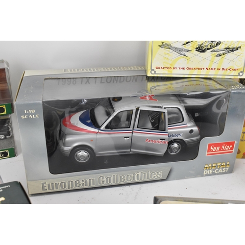 254 - A group of boxed model cars to include a large 1:18 scale European collectables American Airlines Lo... 