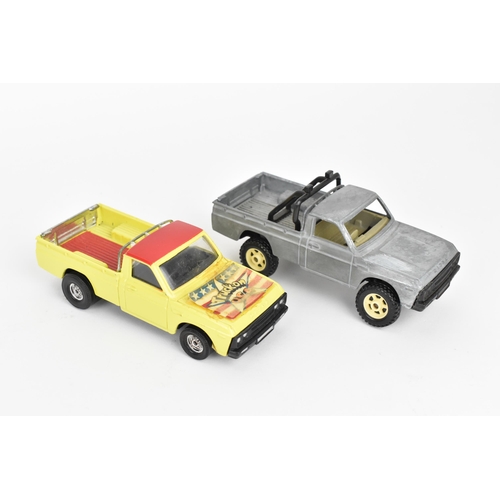 258 - Corgi Toys - a pair of pre-production Mazda B1600 pick-up trucks, unboxed, one decorated in yellow a... 