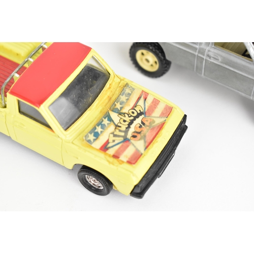 258 - Corgi Toys - a pair of pre-production Mazda B1600 pick-up trucks, unboxed, one decorated in yellow a... 