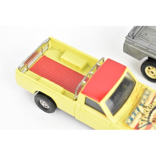 258 - Corgi Toys - a pair of pre-production Mazda B1600 pick-up trucks, unboxed, one decorated in yellow a... 