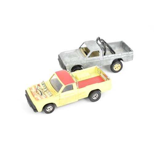 258 - Corgi Toys - a pair of pre-production Mazda B1600 pick-up trucks, unboxed, one decorated in yellow a... 