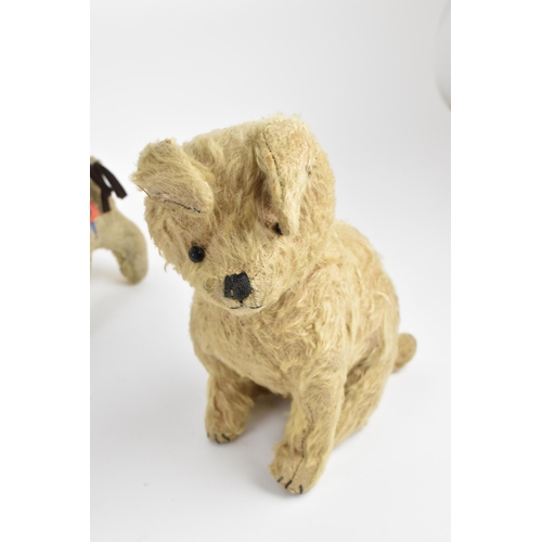 263 - A group of six vintage soft toys to include a possibly Steiff 'Tabby' kitten/cat, Chad Valley dog, S... 