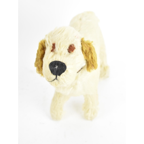 263 - A group of six vintage soft toys to include a possibly Steiff 'Tabby' kitten/cat, Chad Valley dog, S... 