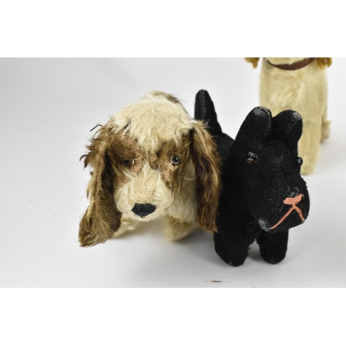 263 - A group of six vintage soft toys to include a possibly Steiff 'Tabby' kitten/cat, Chad Valley dog, S... 