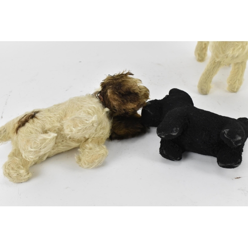 263 - A group of six vintage soft toys to include a possibly Steiff 'Tabby' kitten/cat, Chad Valley dog, S... 