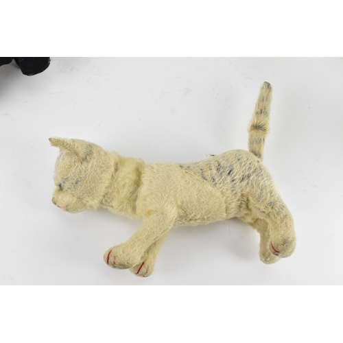 263 - A group of six vintage soft toys to include a possibly Steiff 'Tabby' kitten/cat, Chad Valley dog, S... 