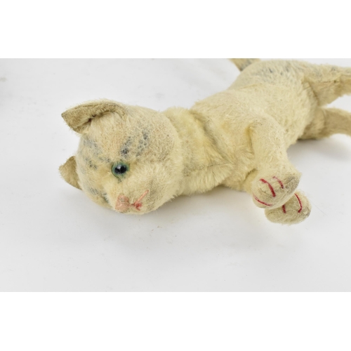 263 - A group of six vintage soft toys to include a possibly Steiff 'Tabby' kitten/cat, Chad Valley dog, S... 