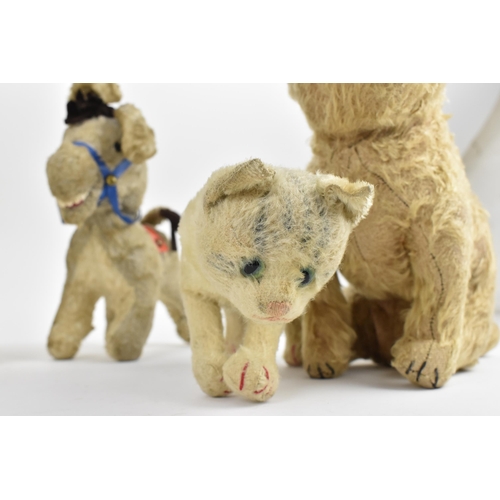 263 - A group of six vintage soft toys to include a possibly Steiff 'Tabby' kitten/cat, Chad Valley dog, S... 