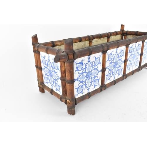 287 - An early 20th century Aesthetic style planter, with Minton style tiles with blue transfer print, in ... 