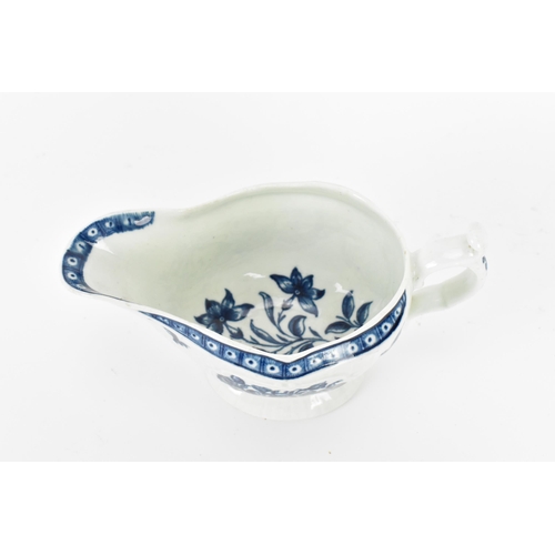 288 - An 18th century blue and white Worcester sauce boat, decorated with florals and moulded cartouche to... 