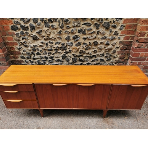 61 - A mid-20th century McIntosh teak sideboard, with two central cupboard doors flanked to one side with... 