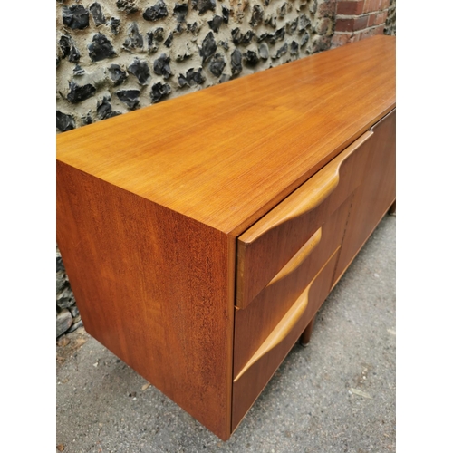 61 - A mid-20th century McIntosh teak sideboard, with two central cupboard doors flanked to one side with... 