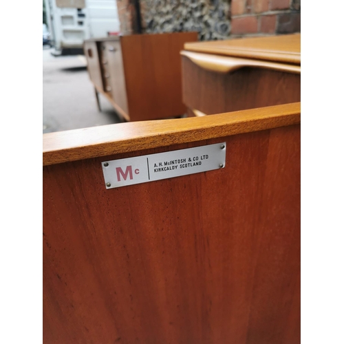 61 - A mid-20th century McIntosh teak sideboard, with two central cupboard doors flanked to one side with... 