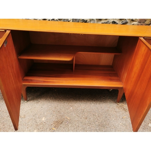 61 - A mid-20th century McIntosh teak sideboard, with two central cupboard doors flanked to one side with... 