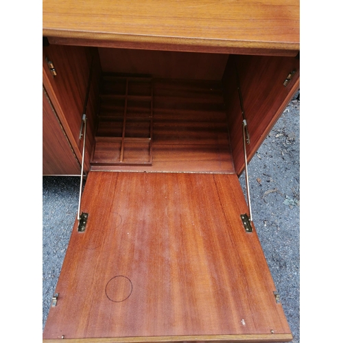 61 - A mid-20th century McIntosh teak sideboard, with two central cupboard doors flanked to one side with... 