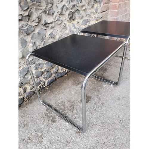 63 - A pair of Marcel Breuer for Knoll Studio laminate and chrome coffee tables, in black, together with ... 