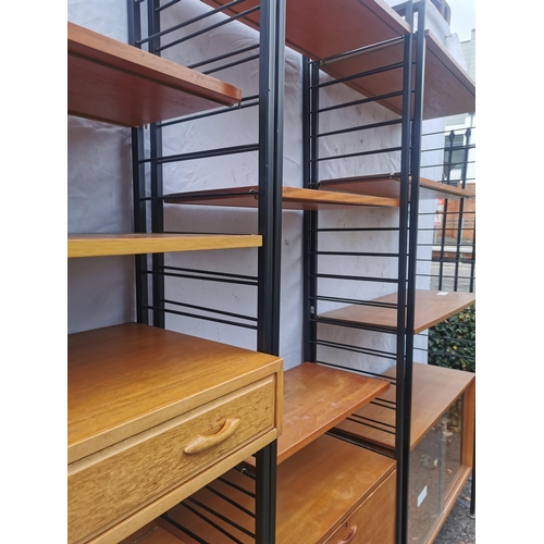 64 - Five retro vintage late 20th century Ladderax modular teak shelving units, with multiple shelves and... 