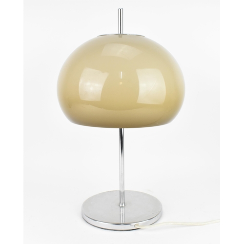 74 - A mid century Guzzini style table lamp, circa 1960 - 1970, with a mushroom shade, on a chrome stem a... 