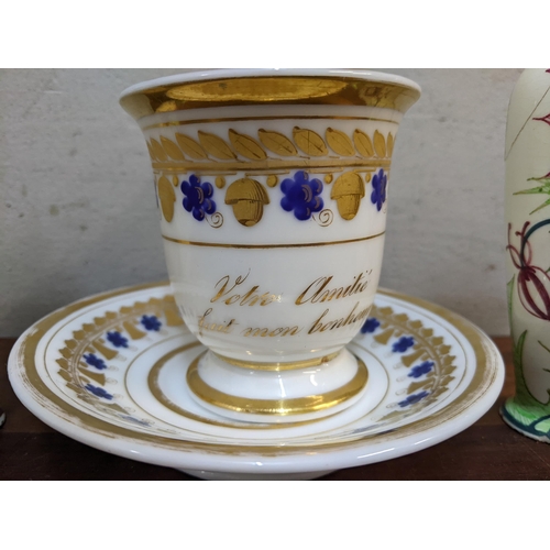 442 - A 19th century German cabinet cup and saucer, together with a pair of Dutch vases Location: 10.1