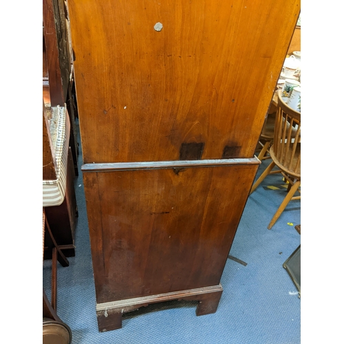 473 - An early 19th century mahogany chest on chest with two short and three graduated long drawers above ... 