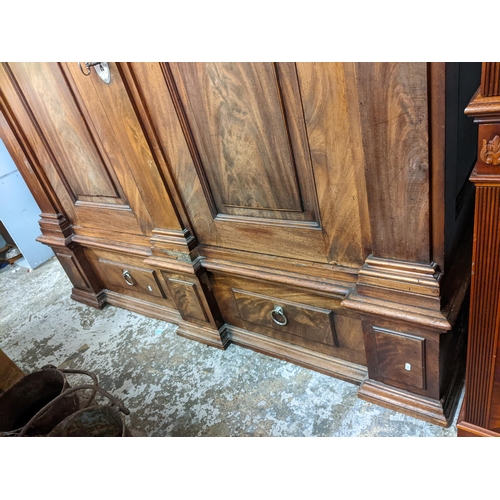 473 - An early 19th century mahogany chest on chest with two short and three graduated long drawers above ... 