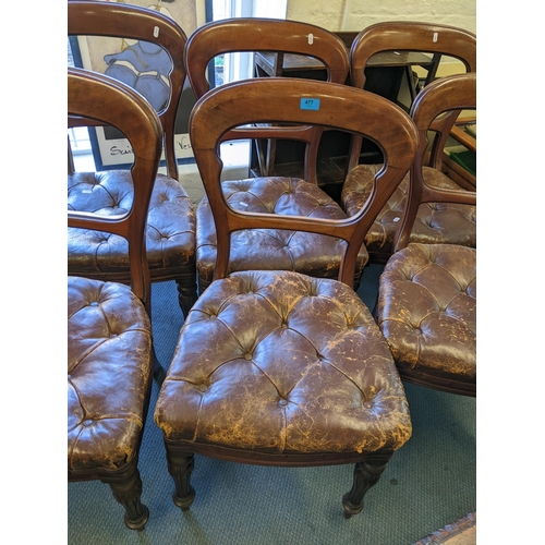 477 - A set of six Victorian mahogany bar back dining chairs with leather button upholstered seats on carv... 