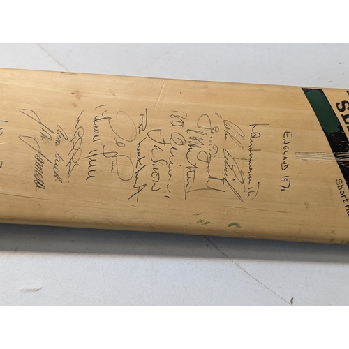 479 - A signed Slazenger cricket bat, signed by the 1971 teams of England and India to one side, and Middl... 