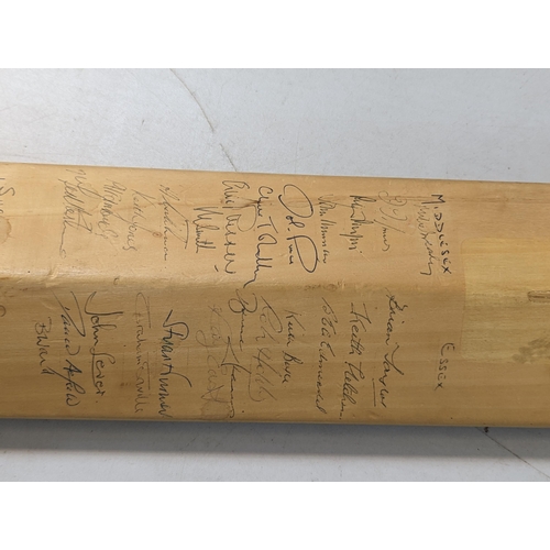 479 - A signed Slazenger cricket bat, signed by the 1971 teams of England and India to one side, and Middl... 