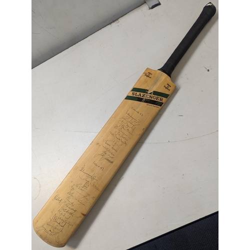 479 - A signed Slazenger cricket bat, signed by the 1971 teams of England and India to one side, and Middl... 