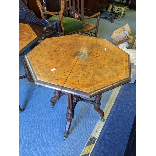 481 - A pair of Victorian walnut octagonal quarter cut veneered occasional tables with fluted columns and ... 