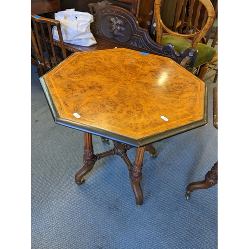 481 - A pair of Victorian walnut octagonal quarter cut veneered occasional tables with fluted columns and ... 