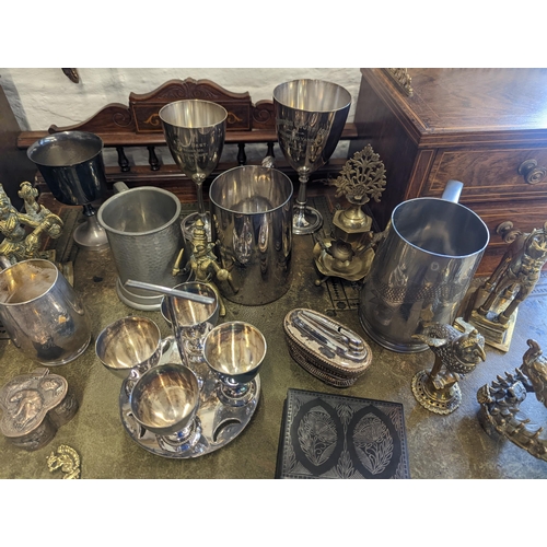 519 - A mixed lot of metalware to include Chinese pewter tankards and other examples, brass and copper Ind... 