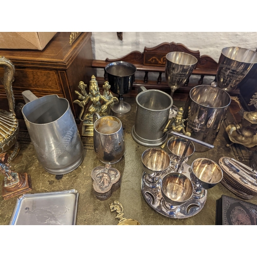 519 - A mixed lot of metalware to include Chinese pewter tankards and other examples, brass and copper Ind... 