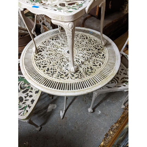 447 - A late 20th century white painted cast metal garden table and four chairs
Location: G