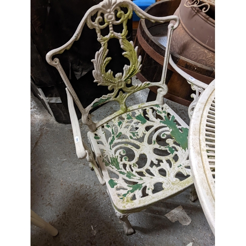 447 - A late 20th century white painted cast metal garden table and four chairs
Location: G