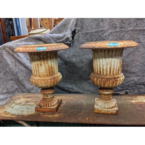 454 - A pair of late 20th century white painted cast iron garden urns, 36cm high
Location: G