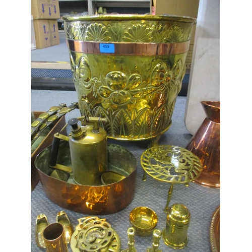 459 - A selection of Victorian and later brass and copper ware to include a coal bucket with embossed bow ... 