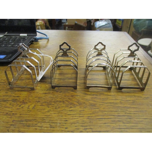 468 - A pair of Edward Viners George VI silver toast racks, and another by the same maker in similar shape... 