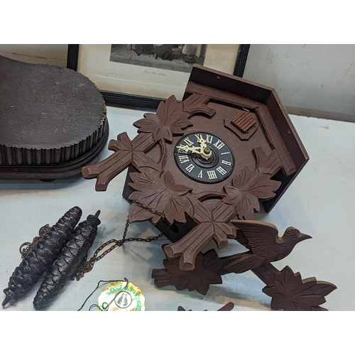 503 - A mixed lot to include a Napoleon hat style mantel clock, cuckoo clock and a pair of framed and glaz... 