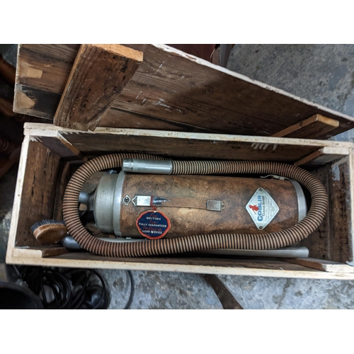 535 - Fishing related items to include two wooden and brass reels, and a vintage vacuum cleaner Location: ... 