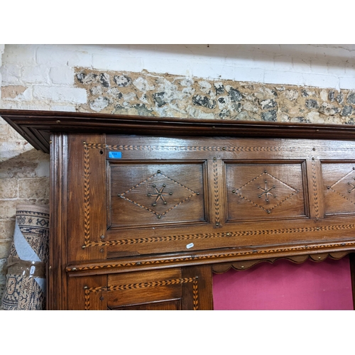 494 - A 19th century Continental cabinet having marquetry inlaid, metal studs, two side doors and central ... 