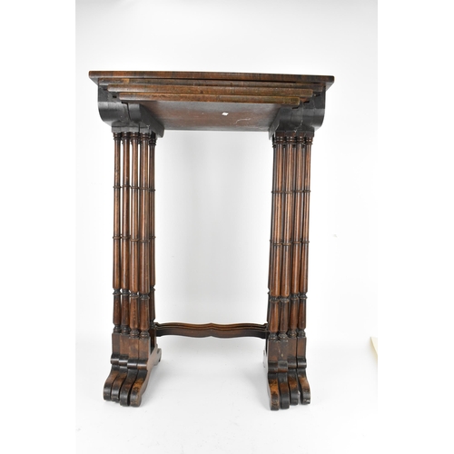 167 - A regency rosewood quartetto of tables, the rectangular tops raised on slender ring-turned legs join... 