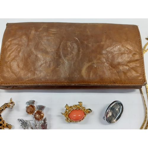 125 - YSL-A vintage brown leather YSL purse A/F together with a quantity of costume jewellery to include p... 