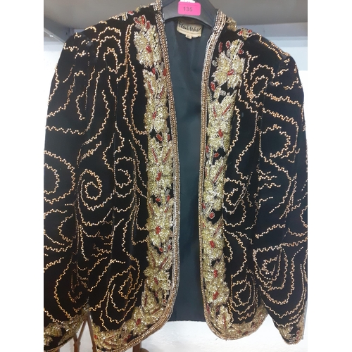 135 - Frank Usher-A late 20th Century heavily beaded black velvet ladies jacket, size m, 36