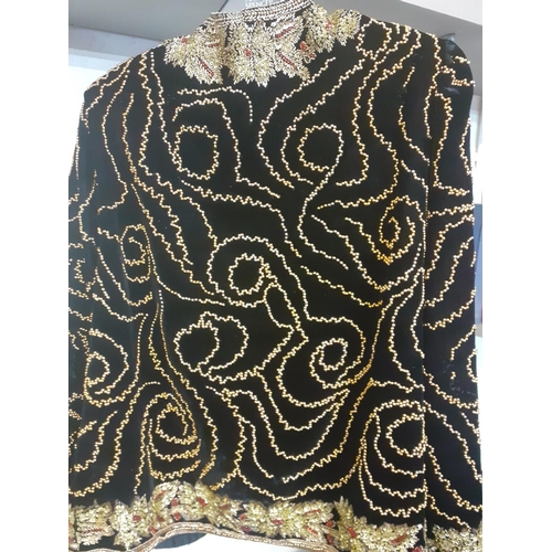 135 - Frank Usher-A late 20th Century heavily beaded black velvet ladies jacket, size m, 36