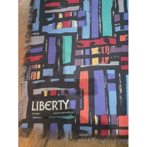 31 - Liberty-A large 1980's multi-coloured and geometric wrap with fringed edges 53