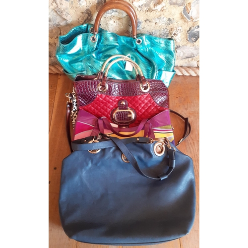 33 - Four modern High Street fashion bags to include a Ted Baker pearlised turquoise over-sized handbag w... 