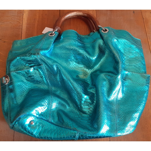 33 - Four modern High Street fashion bags to include a Ted Baker pearlised turquoise over-sized handbag w... 