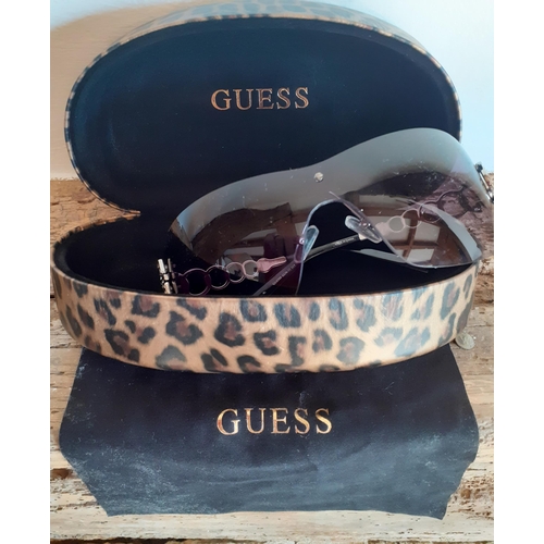 89 - Guess-A pair of ladies black frameless sunglasses with ornate silver tone arms and iconic 'G' encirc... 